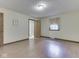 Bedroom showcasing wood-look flooring and an ensuite bathroom through an open door at 31 N Restin Rd, Greenwood, IN 46142