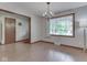 Bright dining room with large windows, wood floors, and a charming chandelier at 31 N Restin Rd, Greenwood, IN 46142