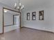 Well-lit dining room offering hardwood flooring, decorative wall niches, and view of a kitchen area at 31 N Restin Rd, Greenwood, IN 46142