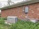 Brick house with a Kohler generator and utility connections, ensuring reliable power for modern living at 31 N Restin Rd, Greenwood, IN 46142