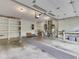 This garage has ample storage with built-in shelving, utility sink, water heater, and good lighting for projects at 31 N Restin Rd, Greenwood, IN 46142