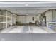 This garage has ample storage with built-in shelving, utility sink, water heater, and good lighting for projects at 31 N Restin Rd, Greenwood, IN 46142