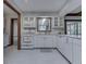 Classic white kitchen featuring modern appliances, white subway tile, and marble countertops at 31 N Restin Rd, Greenwood, IN 46142