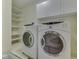Well-equipped laundry room with shelving and modern, front-load washing machines at 31 N Restin Rd, Greenwood, IN 46142