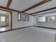 Open-concept living room showing the wall mirrors and connecting to a kitchen area at 31 N Restin Rd, Greenwood, IN 46142