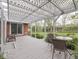 Cozy patio with pergola, chairs, and table, offering a relaxing outdoor space and access to the backyard at 31 N Restin Rd, Greenwood, IN 46142
