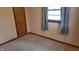 Bedroom with carpeted floors, standard door, and natural light at 3412 Loral Dr, Anderson, IN 46013