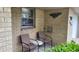Welcoming front porch featuring comfortable seating and decorative architectural brickwork at 3412 Loral Dr, Anderson, IN 46013
