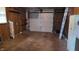 Unfinished garage with open space and wood paneling at 3412 Loral Dr, Anderson, IN 46013