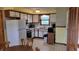 Functional kitchen with classic cabinetry and appliances, offering a practical cooking space at 3412 Loral Dr, Anderson, IN 46013