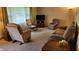 Cozy living room featuring carpet flooring and large window, with a traditional furniture arrangement at 3412 Loral Dr, Anderson, IN 46013