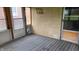 Enclosed porch with striped carpet, brick accent wall and views at 3412 Loral Dr, Anderson, IN 46013