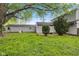 Spacious backyard featuring lush greenery, mature trees, and a detached garage, perfect for outdoor activities at 3425 N Elizabeth St, Indianapolis, IN 46226