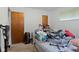 Bedroom with beige carpet, a closet, and a window at 3425 N Elizabeth St, Indianapolis, IN 46226