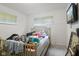 Bright bedroom featuring a bed, window, and a mounted TV, offering potential for customization and comfort at 3425 N Elizabeth St, Indianapolis, IN 46226