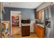 Traditional kitchen with stainless steel refrigerator and cabinetry, view into living room at 3425 N Elizabeth St, Indianapolis, IN 46226