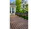 A wood deck offers outdoor living space, with a fenced-in yard and views of green space at 3438 Windy Knoll Ln, Carmel, IN 46074