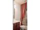 Cozy bathroom with wood vanity, white countertop, and a shower with colorful curtain at 3438 Windy Knoll Ln, Carmel, IN 46074