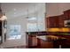 Open concept kitchen area with stainless steel appliances and island with seating at 3438 Windy Knoll Ln, Carmel, IN 46074