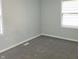 Bedroom with two windows and carpet floors at 3453 Payton Ave, Indianapolis, IN 46226