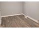 Bedroom featuring neutral walls and wood floors at 3453 Payton Ave, Indianapolis, IN 46226