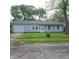 Charming one-story home with a well-maintained lawn and a one car garage at 3453 Payton Ave, Indianapolis, IN 46226