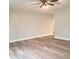 Spacious living room with wood flooring, neutral paint, and ample natural light at 3453 Payton Ave, Indianapolis, IN 46226
