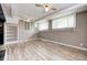 Image of a finished basement with new floors, multiple windows and ceiling fans at 3514 Eisenhower Dr, Indianapolis, IN 46224