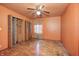 Bedroom with hardwood floors, ceiling fan, curtains and a closet at 3514 Eisenhower Dr, Indianapolis, IN 46224