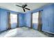 Shot of a bedroom featuring a ceiling fan and two windows at 3514 Eisenhower Dr, Indianapolis, IN 46224