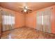 View of a bedroom with a ceiling fan and hardwood floors at 3514 Eisenhower Dr, Indianapolis, IN 46224