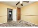 Bedroom features a closet, ceiling fan, window, and adjoins the bathroom at 3514 Eisenhower Dr, Indianapolis, IN 46224