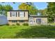 Charming two-story home with a well-maintained lawn and a mix of brick and siding exterior at 3514 Eisenhower Dr, Indianapolis, IN 46224