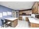 Functional kitchen space with an island and a view of the stairs, offering potential for customization at 3514 Eisenhower Dr, Indianapolis, IN 46224