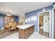 Picture of a kitchen and dining area featuring an island and a wooden table at 3514 Eisenhower Dr, Indianapolis, IN 46224