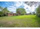 Large grassy backyard offers plenty of space for outdoor activities, gardening, and entertaining with Gathering at 3605 Redfern Dr, Indianapolis, IN 46237