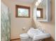 Cozy bathroom featuring a pedestal sink, window and a tub with a patterned shower curtain at 3605 Redfern Dr, Indianapolis, IN 46237