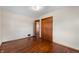 Bright bedroom features hardwood floors, closet, and an open doorway at 3605 Redfern Dr, Indianapolis, IN 46237