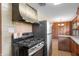 The kitchen features stainless steel appliances, retro style and open breakfast nook at 3605 Redfern Dr, Indianapolis, IN 46237