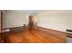 Spacious living room with gleaming hardwood floors and neutral walls at 3605 Redfern Dr, Indianapolis, IN 46237