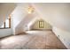 Unfinished attic space with natural light, ceiling fans, and dormer windows at 3660 S Conservation Club Rd, Morgantown, IN 46160