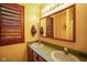 Bathroom featuring double sinks and framed mirror at 3660 S Conservation Club Rd, Morgantown, IN 46160