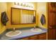 Bathroom with dual sinks and vanity mirror at 3660 S Conservation Club Rd, Morgantown, IN 46160