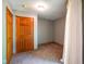 Small bedroom features gray walls, carpet, and a door to hallway at 3660 S Conservation Club Rd, Morgantown, IN 46160