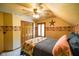 Cozy bedroom with ceiling fan and built-in closet at 3660 S Conservation Club Rd, Morgantown, IN 46160
