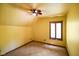 Bright bedroom with ceiling fan and shuttered window at 3660 S Conservation Club Rd, Morgantown, IN 46160