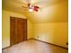 Bedroom with ceiling fan and built-in closet at 3660 S Conservation Club Rd, Morgantown, IN 46160