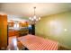 Bright dining area features wood floors and a view of the adjacent kitchen at 3660 S Conservation Club Rd, Morgantown, IN 46160