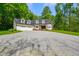 Traditional two-story home featuring a brick entryway, attached garage, and mature trees at 3660 S Conservation Club Rd, Morgantown, IN 46160