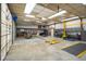Spacious garage with high ceilings, ample lighting, and a large roll-up door at 3660 S Conservation Club Rd, Morgantown, IN 46160